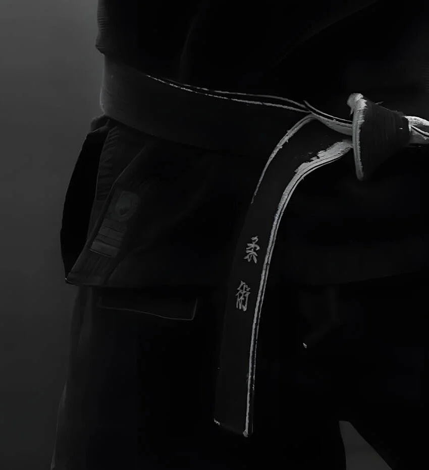 Black belt with stripes over a black gi